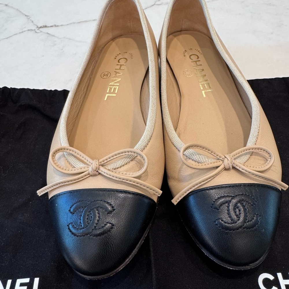 CHANEL Beige and Black Cap-Toe Flats